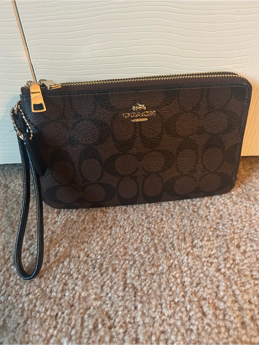 Coach Monogram Double Zip Wristlet in Brown and Black with Gold Hardware. F16109